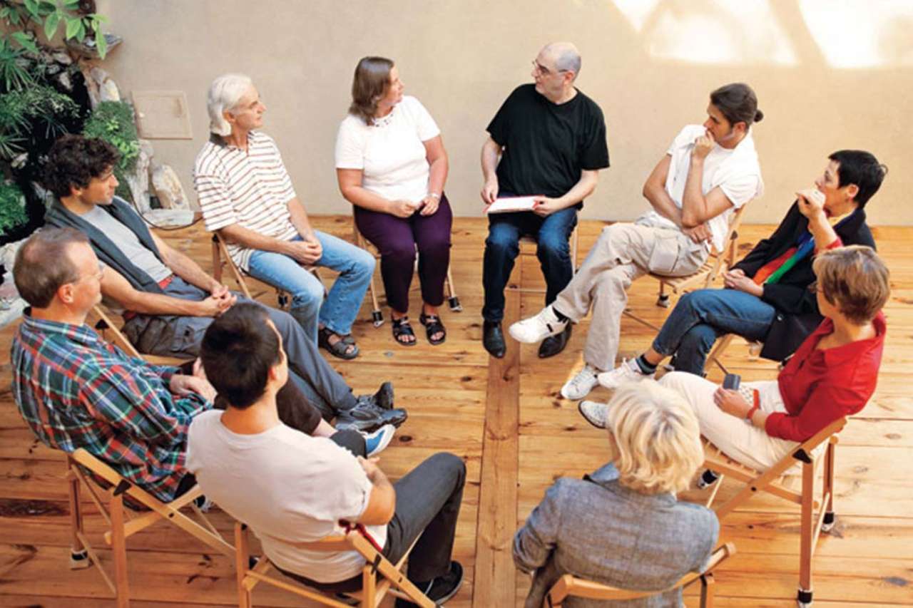 Group of people seated in a circle participating on Advance Care Planning.