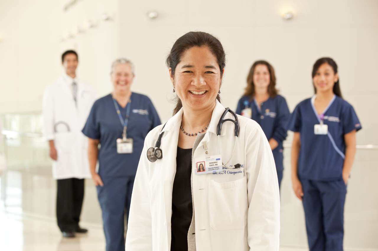 five medical professionals from the orthopedics team smiling for a photo