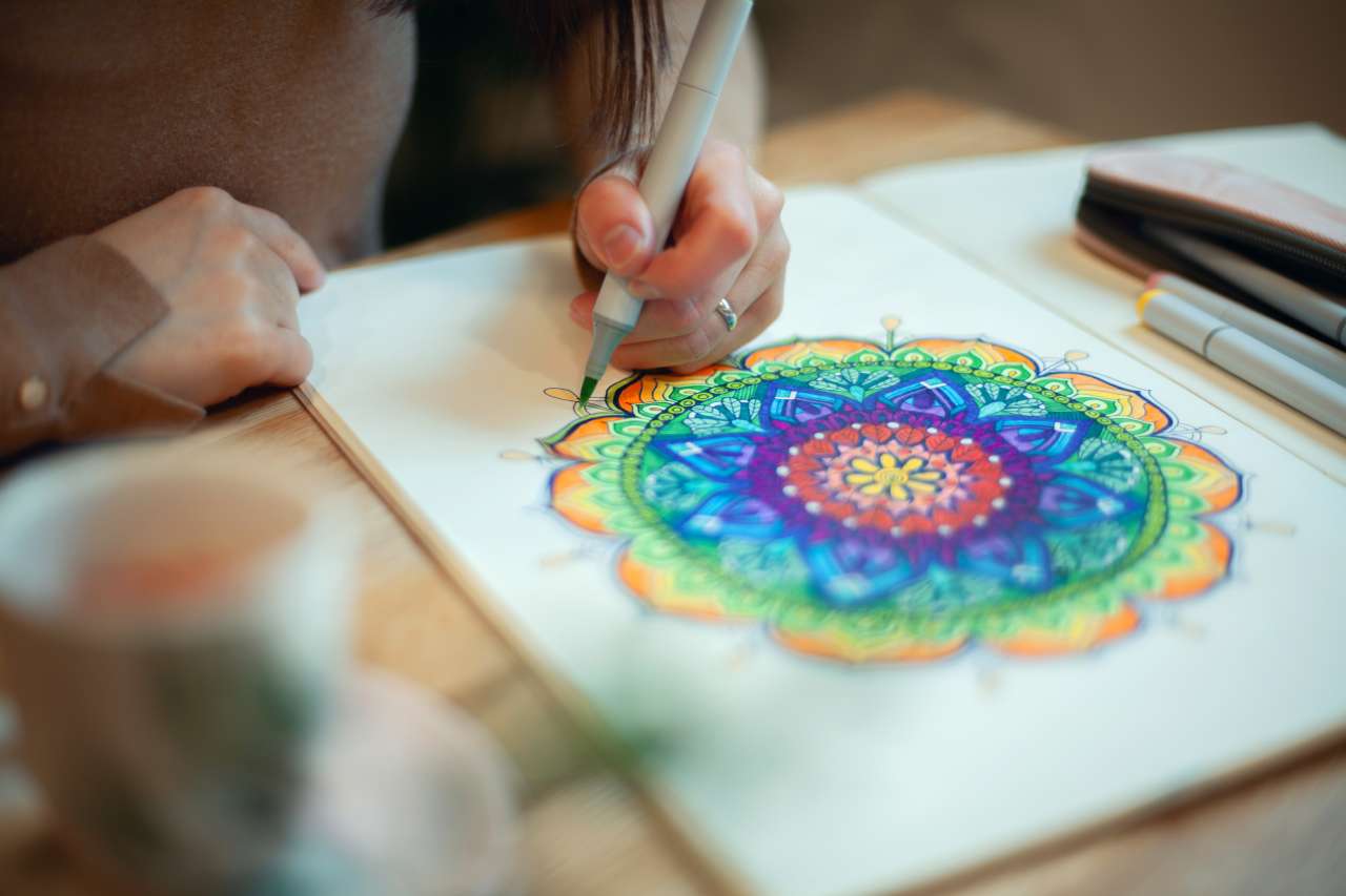 Woman drawing a geometric shape