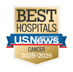 Gold badge with "Best Hospitals" at the top, a blue ribbon with "U.S. News & World Report," and "Cancer 2025-2026" below.